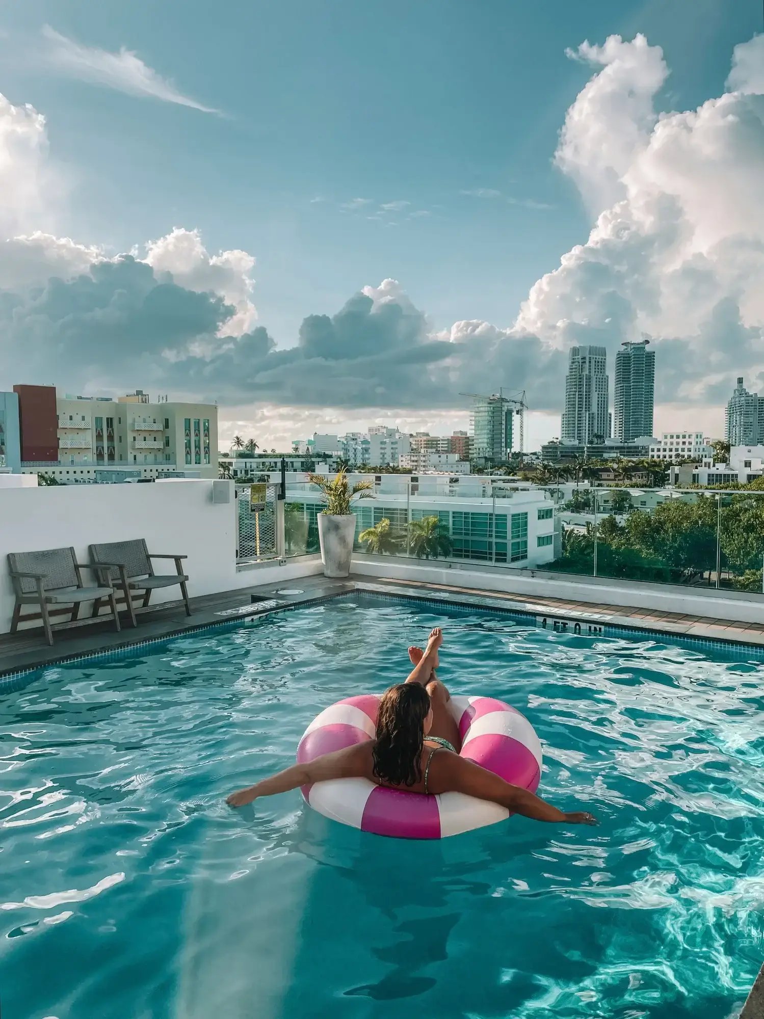 Guest relaxing in the rooftop pool at Upsun Hotel near South of Fifth Miami