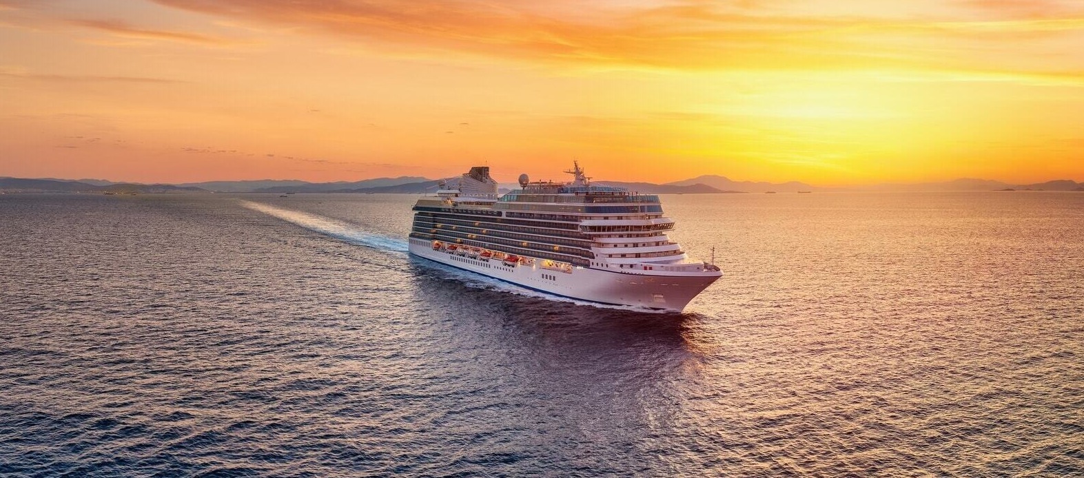 Luxury cruise ship docked in Miami with clear blue skies and ocean views.