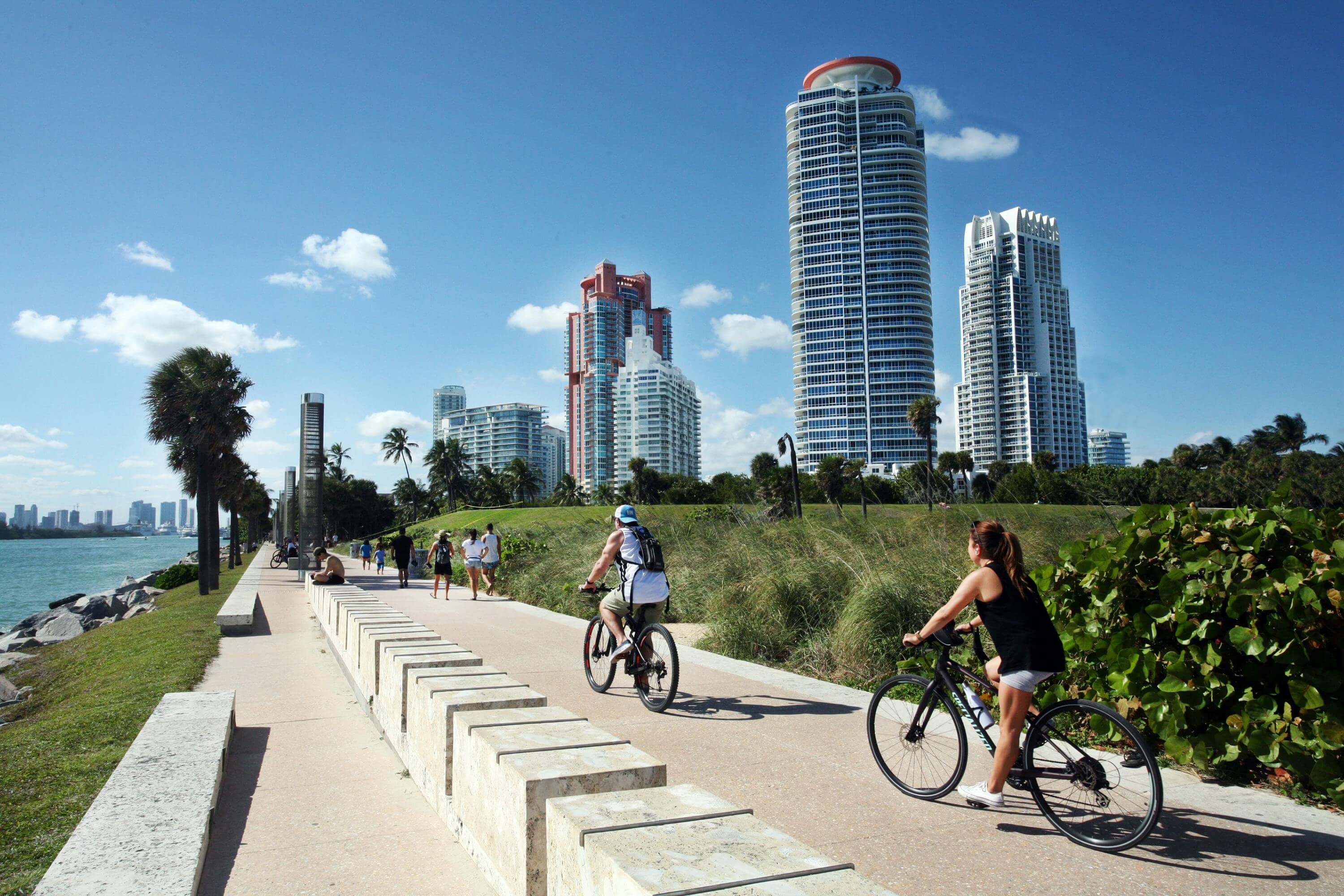 South Pointe Park Miami Beach waterfront promenade with cyclists and high-rise towers