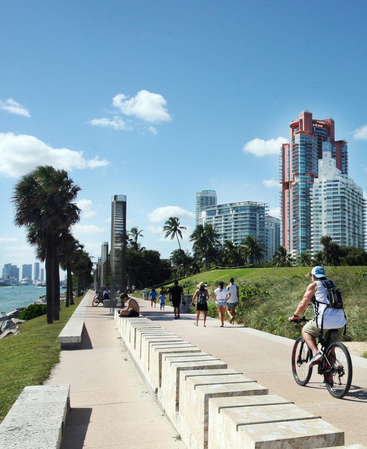 South Pointe Park Miami Beach waterfront promenade with cyclists and high-rise towers