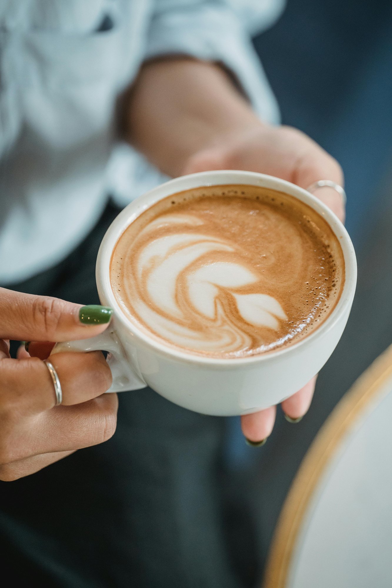 A woman holding a coffee 