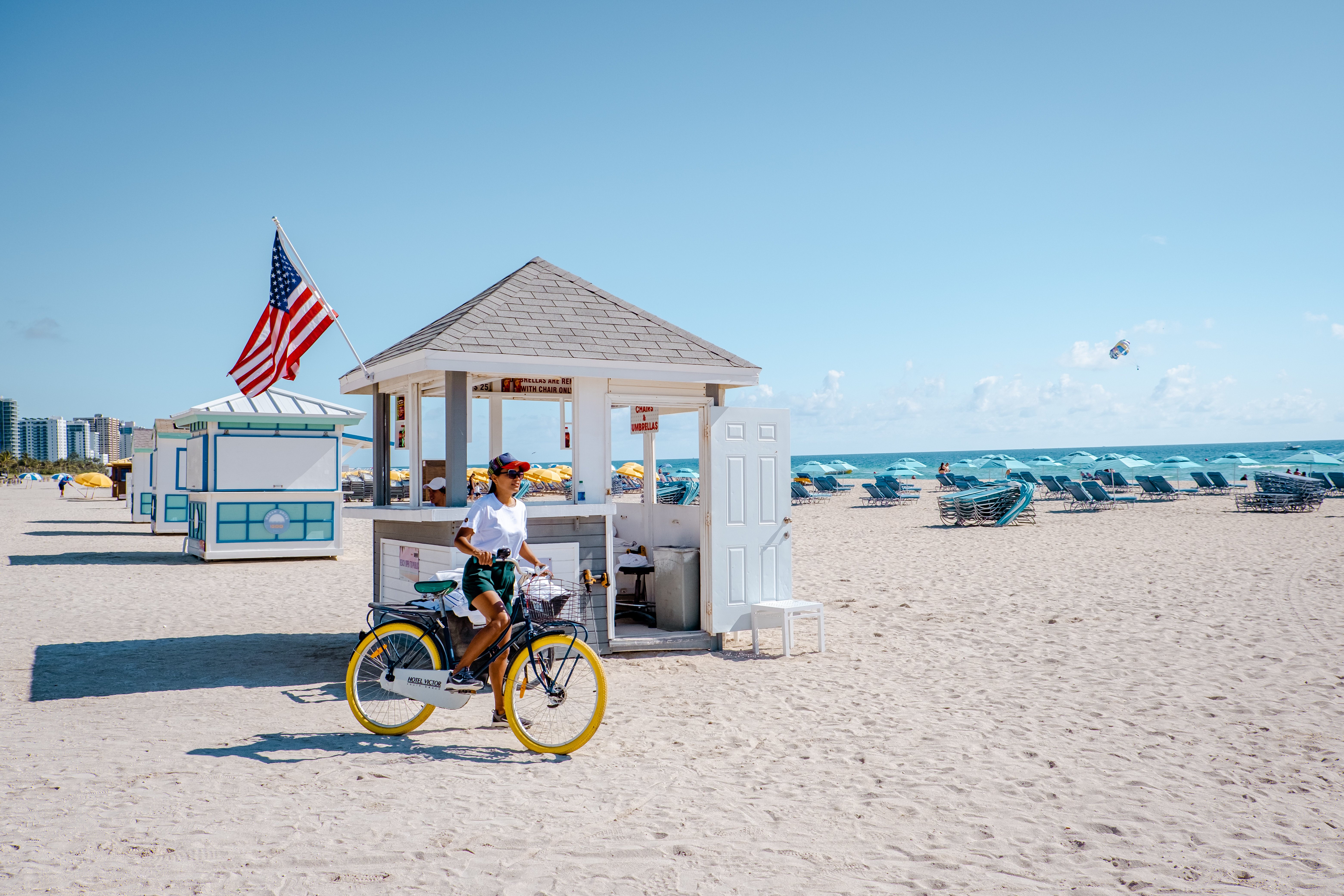 A woman cycling with Upsun Hotel's complimentary bicycle in Miami Beach