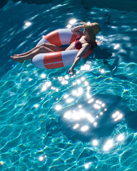 Woman enjoying Upsun Rooftop pool
